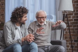 two men discussing reasons to choose men's addiction treatment program