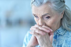 older woman sitting and being concerned with the long term effects of cocaine use