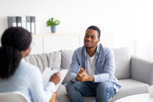 a man talking with a therapist about cbt and what to expect
